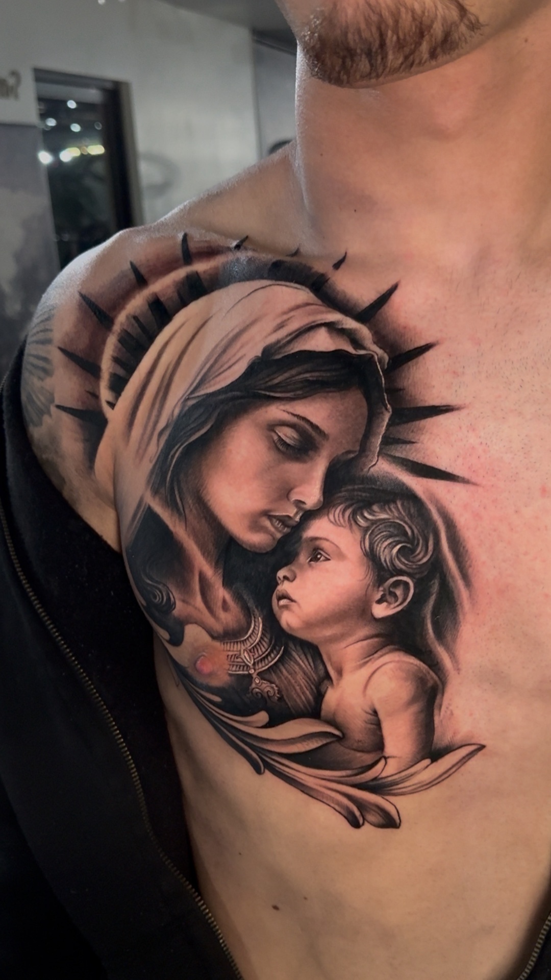 Madonna and child black and grey realism chest tattoo by Gerald Everfade near Sacramento