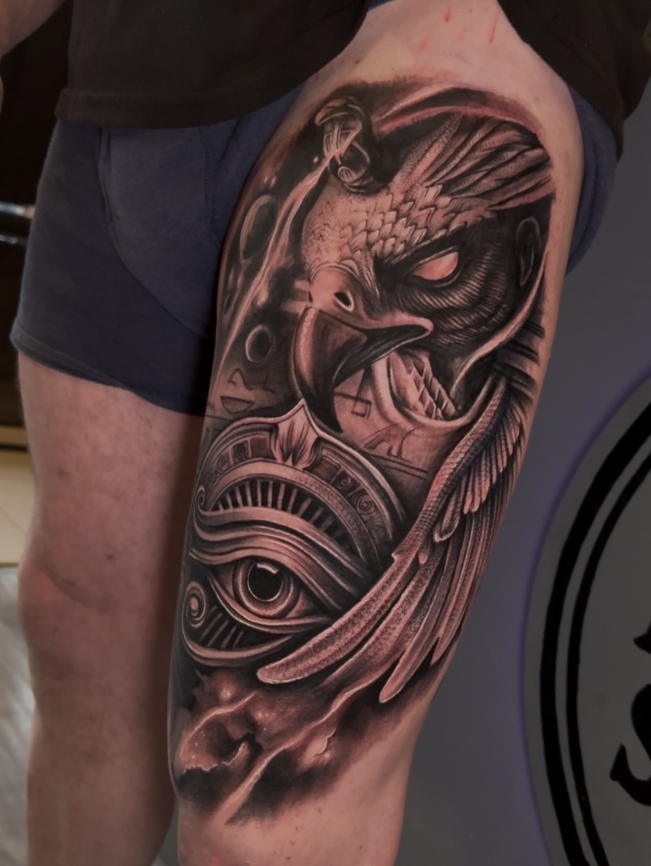 Horus falcon Egyptian black and grey realism thigh tattoo by Gerald Everfade