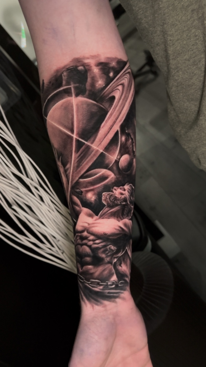 Prometheus and planets black and grey realism forearm tattoo by Gerald Everfade